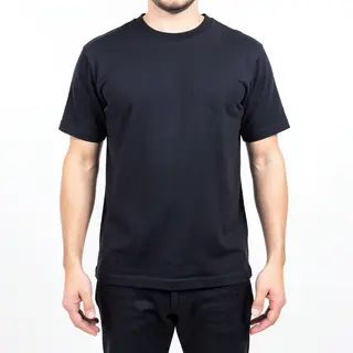 A person standing with both hands visible at their sides, fi