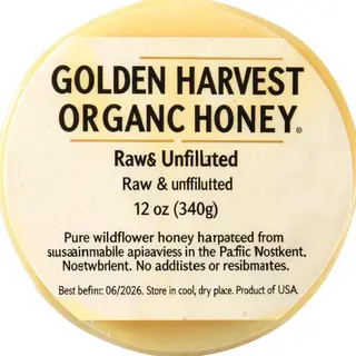 A product label for 'GOLDEN HARVEST ORGANIC HONEY' with subt