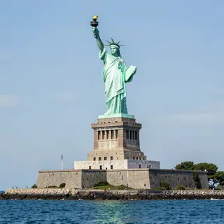 The Statue of Liberty on her island pedestal, with correct t
