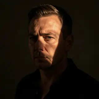 A portrait lit with classic Rembrandt lighting — triangle of