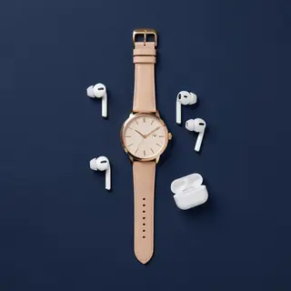 A product flat-lay on a #1A1A2E (deep dark blue) background,