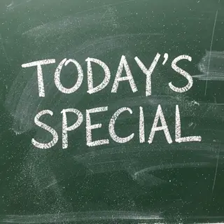 The phrase 'TODAY'S SPECIAL' written in white chalk on a dar