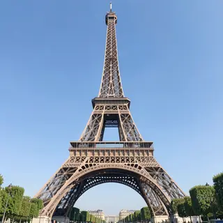 The Eiffel Tower in Paris on a clear day, architecturally ac