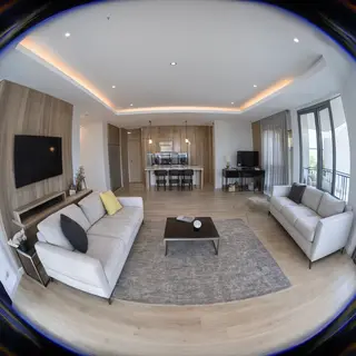 A wide-angle shot of a modern living room interior showing e
