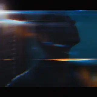 A cinematic frame with blue and orange anamorphic lens flare
