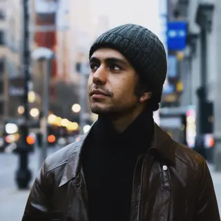A street photograph with shallow depth of field as if shot a