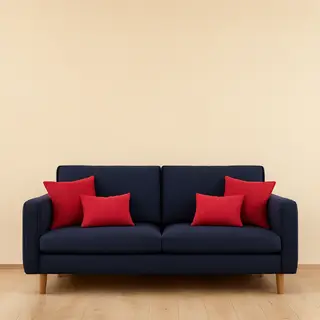 A minimalist room with walls in #F5E6CC (warm cream), a sofa