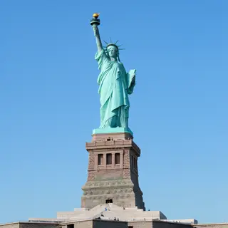 The Statue of Liberty on her island pedestal, with correct t