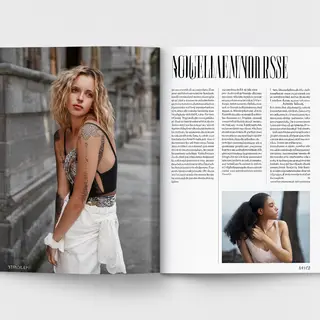 A fashion magazine spread with a full-bleed left-page photo,
