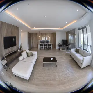 A wide-angle shot of a modern living room interior showing e