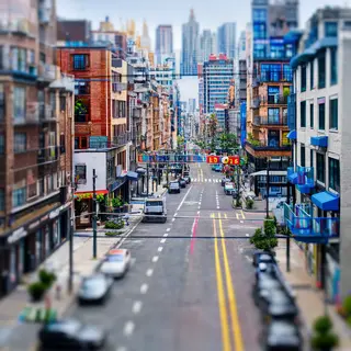 A tilt-shift photograph of a city street making real-life lo