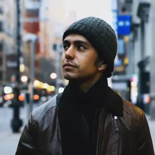 A street photograph with shallow depth of field as if shot a