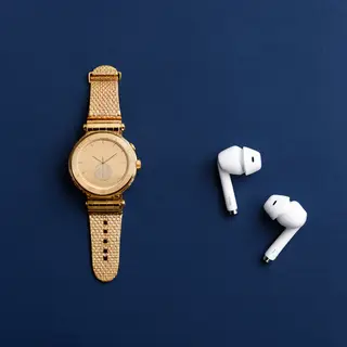 A product flat-lay on a #1A1A2E (deep dark blue) background,