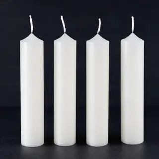 Exactly 4 white candles standing on a dark surface