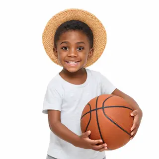 A child holding a basketball, both at correct relative sizes