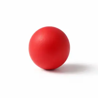 A red sphere on a white surface with a single shadow cast to