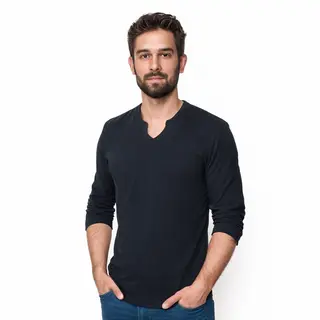 A man standing straight facing the camera, hands in pockets,