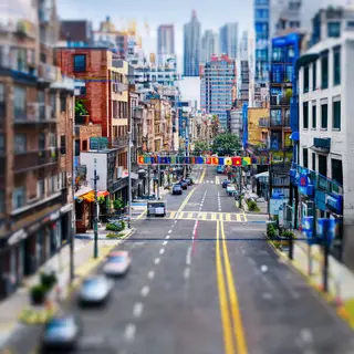 A tilt-shift photograph of a city street making real-life lo