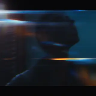 A cinematic frame with blue and orange anamorphic lens flare