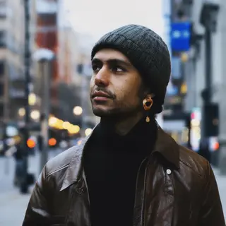 A street photograph with shallow depth of field as if shot a