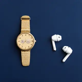 A product flat-lay on a #1A1A2E (deep dark blue) background,