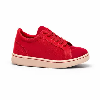 A single red sneaker on a clean white background with soft s