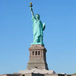 The Statue of Liberty on her island pedestal, with correct t