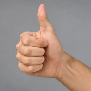 A hand giving a thumbs-up with four fingers curled and thumb