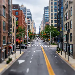 A tilt-shift photograph of a city street making real-life lo