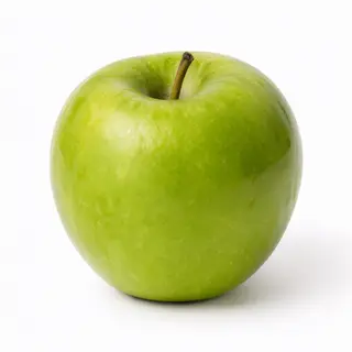 A ripe green apple on a seamless white background with soft 