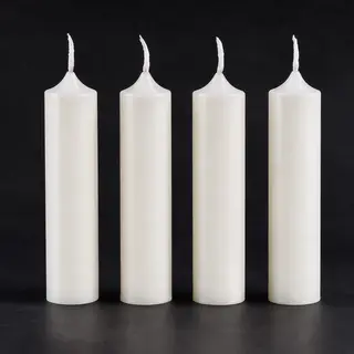 Exactly 4 white candles standing on a dark surface
