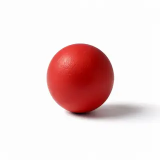 A red sphere on a white surface with a single shadow cast to