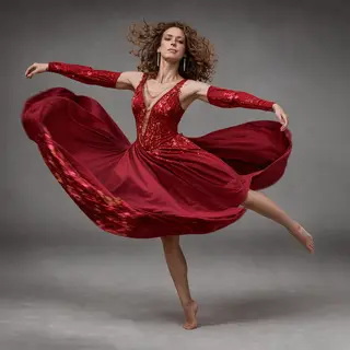 A dancer in a dynamic spin, dress flowing outward with one l