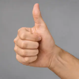 A hand giving a thumbs-up with four fingers curled and thumb