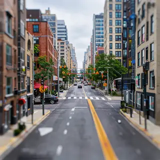 A tilt-shift photograph of a city street making real-life lo