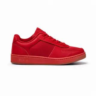 A single red sneaker on a clean white background with soft s