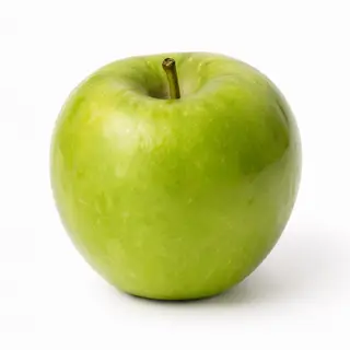 A ripe green apple on a seamless white background with soft 