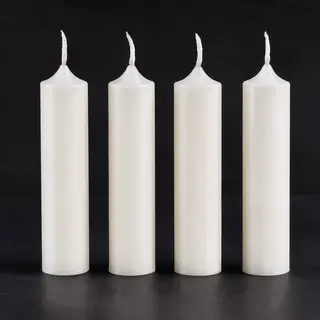Exactly 4 white candles standing on a dark surface
