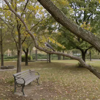 A bird perched on a branch, the branch extending from a tree