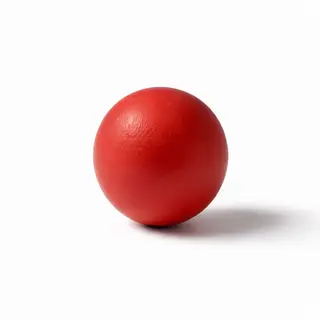 A red sphere on a white surface with a single shadow cast to