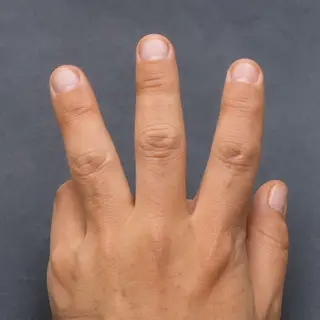 A person counting to three on their fingers, with index, mid
