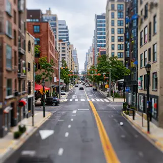 A tilt-shift photograph of a city street making real-life lo