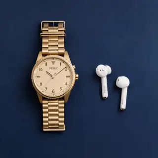A product flat-lay on a #1A1A2E (deep dark blue) background,