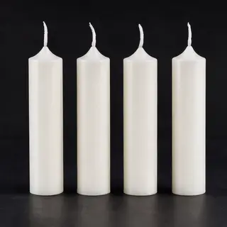 Exactly 4 white candles standing on a dark surface