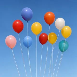 Exactly 11 colorful balloons floating against a clear blue s