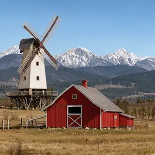 A landscape with a red barn in the foreground at large scale