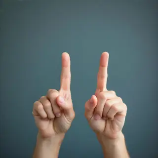 A person counting to three on their fingers, with index, mid