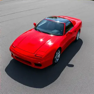 A bright red sports car parked on a gray asphalt road — the 