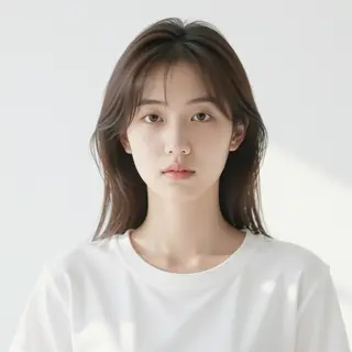 A high-key portrait of a person against a bright white backg