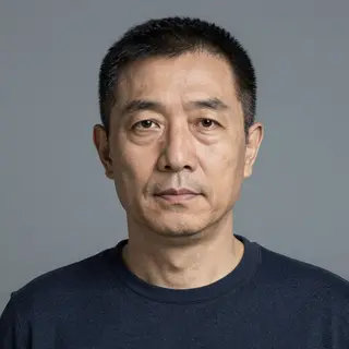 A portrait of a middle-aged man with a calm, serious express